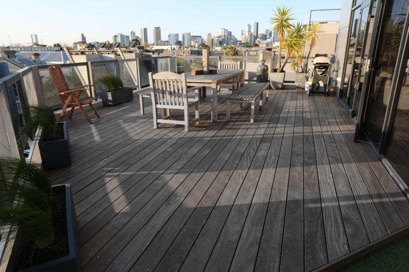  See how Porta Cumaru decking weathers to grey on this city rooftop